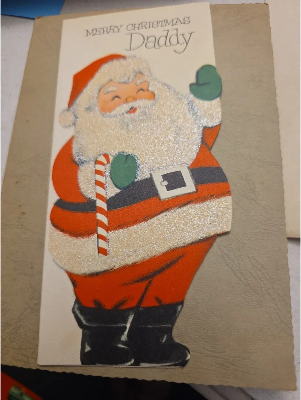 L940 VTG Used Sign Glittered Die Cut Xmas Greeting Card Jolly Santa Waving Hello